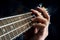 Closeup of guitarist hand playing guitar