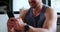Closeup, gym and man with cellphone, typing and connection with fitness blog and social media. Hands, person or athlete