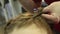 Closeup hairdresser coiffeur makes hairstyle. Close-up hairdresser makes hairstyle for young woman in beauty salon