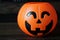 Closeup Halloween pumpkin head jack  on wooden background - interior party festival