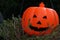 Closeup Halloween pumpkin head jack  on wooden background - interior party festival