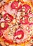 Closeup of ham and pepperoni pizza