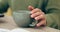 Closeup, hand and cup for coffee in home for relaxing, comfort or delicious taste in morning. Person, entrepreneur and