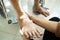 Closeup hand of female physiotherapist check foot of asian senior woman in wheelchair,elderly people suffer from sore muscles,