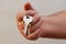 Closeup of hand giving keys on ring