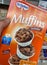 Closeup of hand holding carton box dr. oetker muffins ready baking mix in german supermarket