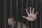 Closeup of a hand holding a steel cage in prison, prisoner concept, Hope to be free.