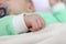 Closeup hand of infant child clenched into a fist