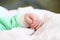 Closeup hand of infant child clenched into a fist