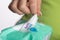 Closeup Hand picked a wet wipes from package - hygiene procedure and prevention of infectious diseases