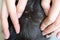 Closeup hand showing big tick parasite on a dog skin, selective focus