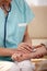 Closeup of hand using stethoscope on wrist