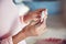 Closeup, hand and woman with a pregnancy test, waiting for the results and wellness at home. Zoom, female person and