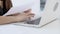 Closeup hand woman working and typing with laptop at office