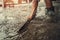 closeup hand of worker plastering cement for building house in concstruction site