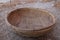 Closeup of handmade bamboo basket on rustic land, threshing basket