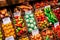 Closeup of handmade marzipan confectionery: miniature fruits in wicker trays.