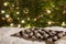 Closeup of handmade sweets of marzipan and cranberries and background of Christmas tree