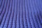 Closeup of handmade violet rib knit fabric