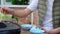 Closeup hands asian family father and mother and daughter eating food at restaurant while celebration birthday.