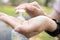 Closeup of hands of asian young woman using alcohol antiseptic gel to prevent infection of Covid-19 outbreak,girl clean hands with