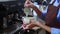 Closeup hands of barista preparing making coffee cappuccino or latte while pouring milk in coffee cup in cafe.