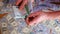 Closeup of the hands of a businessman counting euro banknotes.