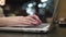 Closeup hands. Businesswoman working on laptop in modern cafe 4k