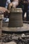 Closeup of the hands of a ceramist potter making a vase with clay