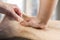 Closeup of hands of chiropractor, physiotherapist doing calf mus