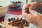 Closeup, Hands are cleaning Damson or plums for traditional cake