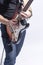 Closeup of Hands and Guitar of Caucasian Musician. Posing Agains