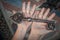 Closeup of hands holds old large huge massive metal key