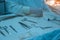 Closeup, the hands of a nurses hand, an assistant surgeon takes a surgical instrument from a sterile table. In a sterile operating