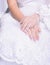 Closeup hands of sitting bride