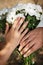 Closeup of hands with wedding rings