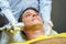 Closeup handsome man having therapy to stimulate facial skin and facial ultrasonic skincare treatment by professional