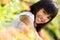 Closeup happy asian little girl sitting on flower field