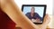 Closeup of happy black man talking on tablet