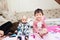 Closeup of happy little child playing over the bed in a relaxed morning