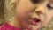 Closeup of Happy Little Girl Face Reading Emotionally. 4K UltraHD, UHD