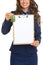 Closeup on happy realtor woman with keys showing blank clipboard