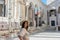 Closeup of a happy young woman on peristyle of Diocletian Palace in Split, Croatia