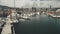 Closeup harbor dock with yachts aerial. Ships and sailboats at marina on ocean bay. Water transport