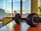 Closeup of headphones used at work placed on a wooden desk with a beautiful view of great and sunny weather outside