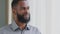 Closeup headshot calm young African ethnicity man drinking glass of fresh pure purified water. Peaceful happy mixed race