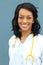 Closeup headshot portrait of friendly, smiling confident female African American healthcare professional with lab coat