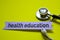 Closeup health education with stethoscope concept inspiration on yellow background