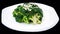 Closeup of healthy broccoli stir fry isolated on black background , chinese cuisine