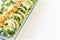 Closeup of healthy salmon salad with avocado and organic vegetables with mustard sauce, selective focus